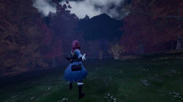 The hunter crosses an open meadow at nightfall, heading for a dark forested mountain